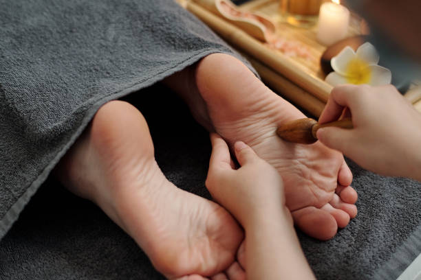 istock Feet Massage with Wooden Sticks 1470908918
