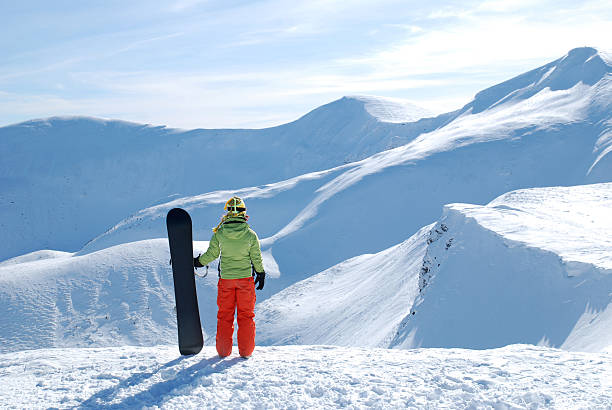 istock Woman with snowboard 147090895