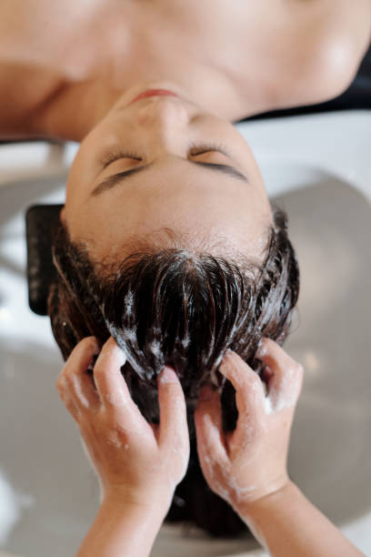 istock Woman Having Hair Washed 1470909276
