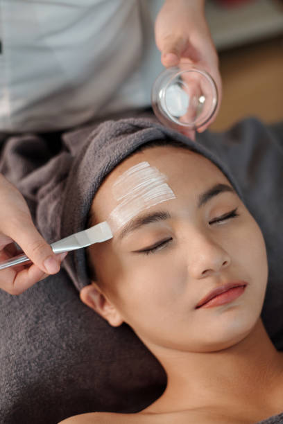 istock Esthetician Applying Moisturizing Mask 1470909483