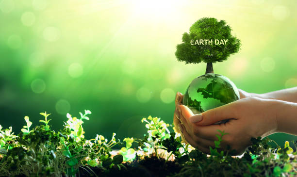 istock Environment day, save clean planet, ecology concept. Earth Day.Hand holding crystal earth globe.Renewable energy-based green businesses can limit climate change and global warming. 1470909998