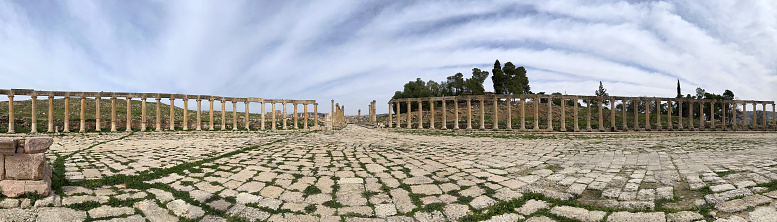 Jerash is the modern name of the remarkably well=preserved ancient city of Gerasa in Jordan, north of Amman. Inhabited since the Bronze Age, the ruins of the walled Greco-Roman settlement outside the modern city are more extensive than either Rome or Pompei. having been protected by and buried in sand for centuries. Featuring the 2nd-century Hadrian’s Arch, Corinthian columns of the Temple of Artemis and the huge Forum’s oval colonnade that leads to the Cado main thoroughfare