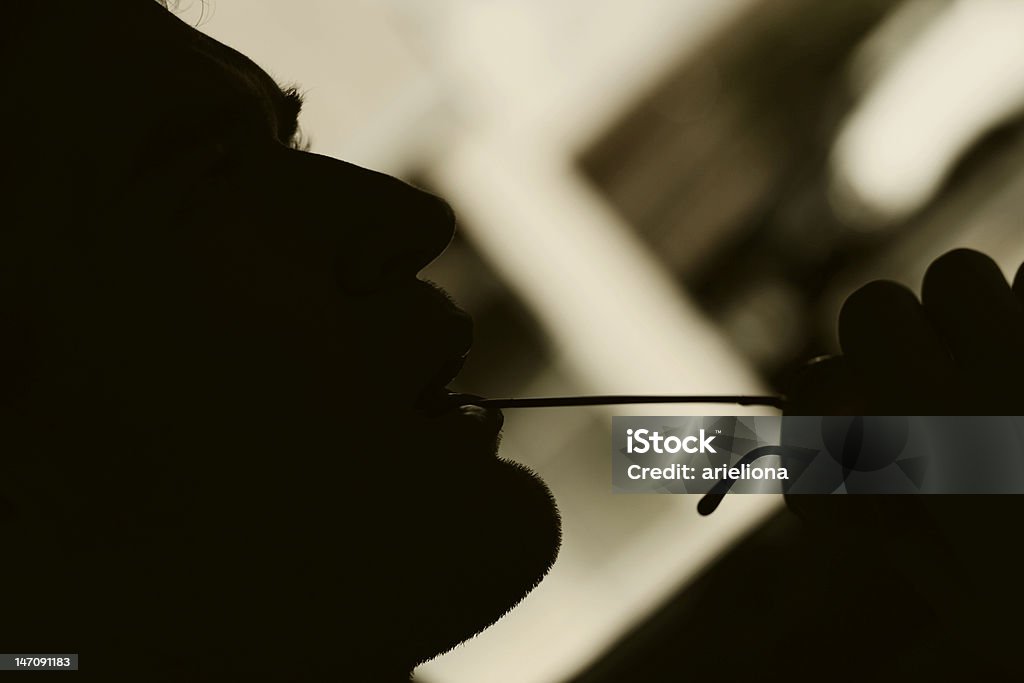 Male Silhouette Silhouette of a man and his glasses Back Lit Stock Photo