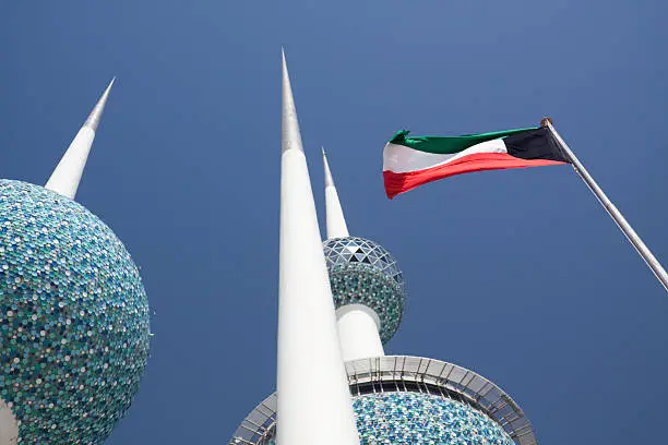 Kuwait Flag with the Kuwait towers in the background.