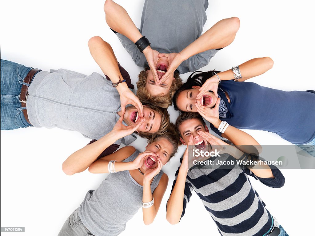 Happy young friends shouting 20-24 Years Stock Photo