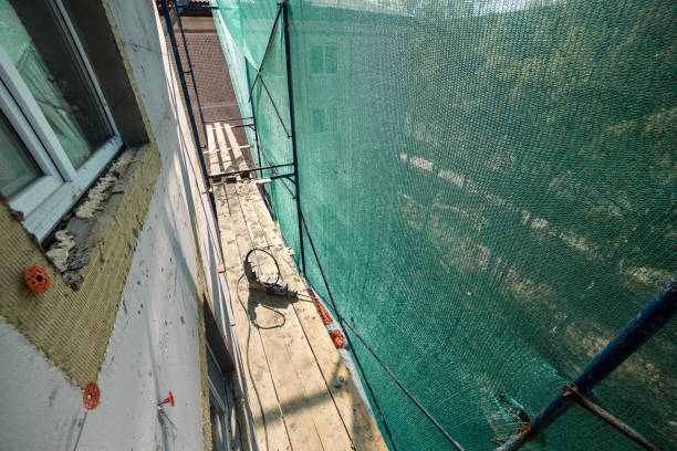 istock Hand drill on the scaffolding on altitude. Concept repairing the wall panel 1470916062