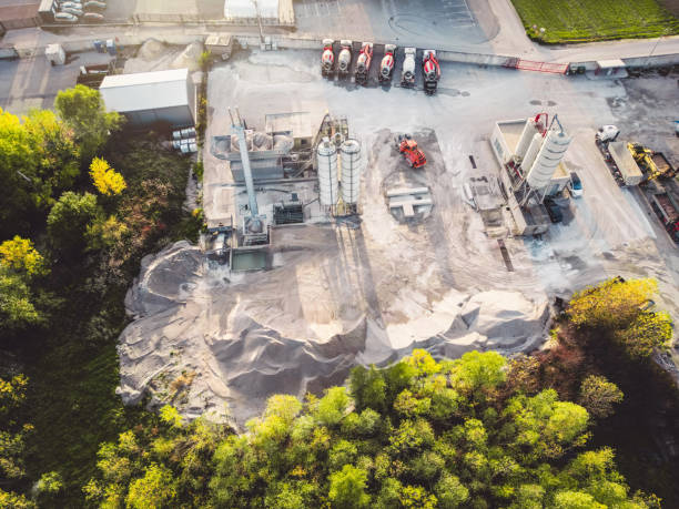 istock Looking down at dust construction company base with piles on gravel on the side 1470916569