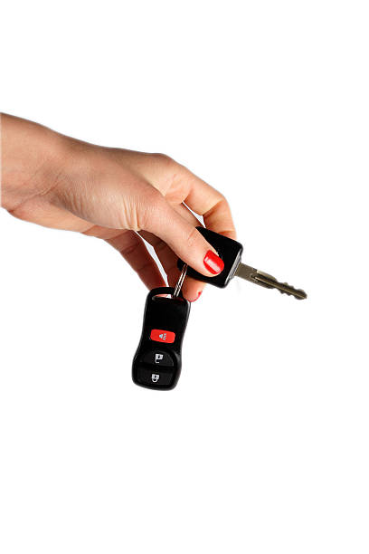 istock new car keys dangling from hand 147091818