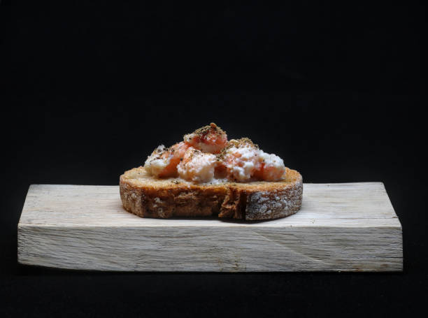 istock Toast with small shrimps in sauce and herbs 1470919281