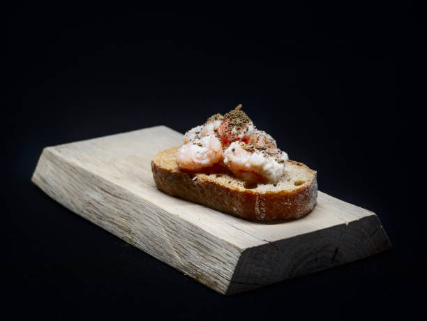 istock Toast with small shrimps in sauce and herbs 1470919282