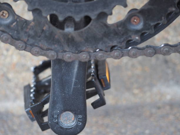 istock Black, gray and light white bicycle chains and pedals 1470920595