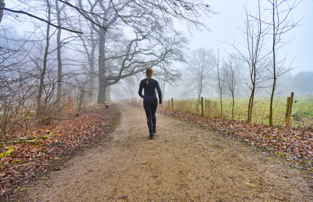 istock Woman running away from camera 1470921586
