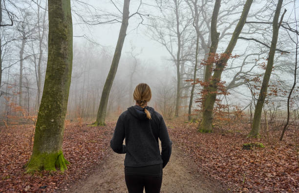 istock Woman running away from camera 1470921782