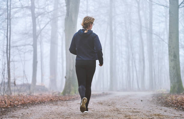 istock Woman running away from camera 1470921935