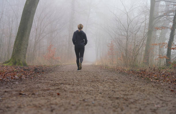 istock Woman running away from camera 1470922724