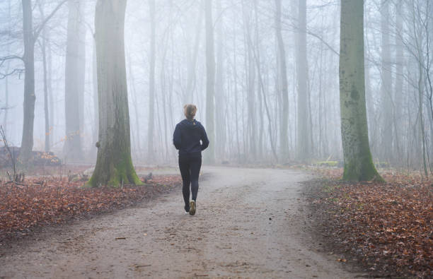 istock Woman running away from camera 1470922871