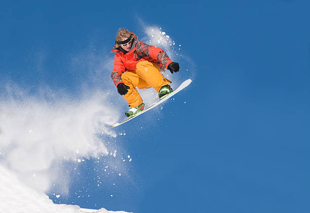 istock Extreme Snowboard Jump Against Clear Blue Sky 147092303