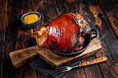 Bavarian Schweinshaxe Roast pork Hock Ham, knuckle with Sauerkraut. Wooden background. Top view