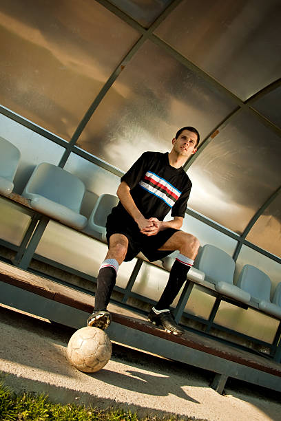 istock Soccer player sitting on the bench 147092506