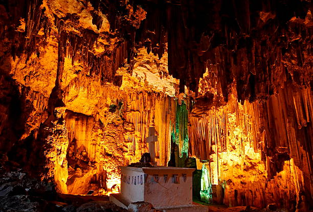 The Grave  under Huge stalactites in Melidoni Cave stock photo
