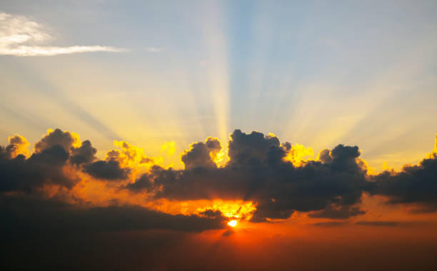 istock Sky at Sunset with Sunbeams and Moody Clouds 1470927477