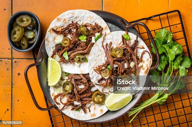 Spicy Beef Barbacoa Tacos With Cilantro And Onion Orange Background Top View Stock Photo - Download Image Now