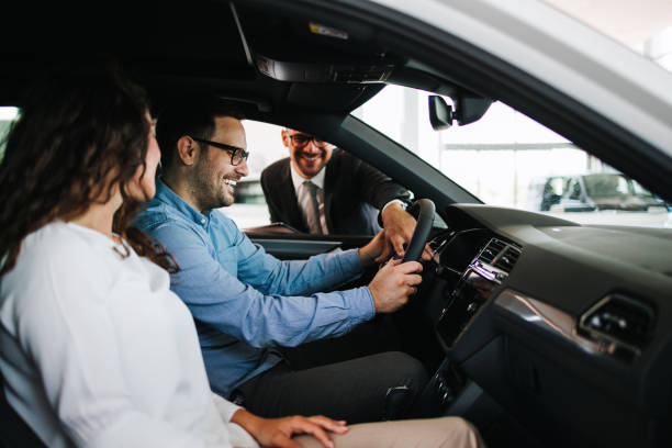 istock Attractive couple buying new car 1470929493