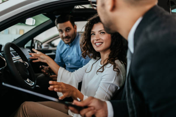 istock Attractive couple buying new car 1470930044