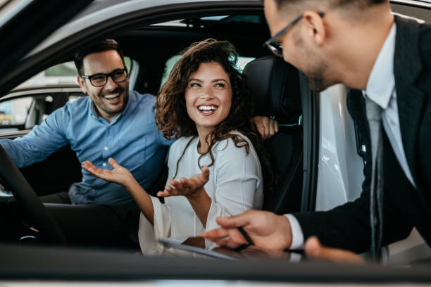 istock Attractive couple buying new car 1470930046