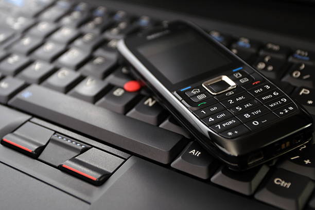 istock Mobile phone(clean) and laptop keyboard 147093055