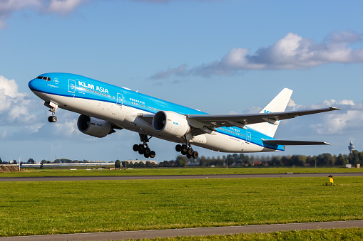 Amsterdam, Netherlands - October 8, 2022: KLM Asia Boeing 777-200ER airplane at Amsterdam Schiphol airport (AMS) in the Netherlands.