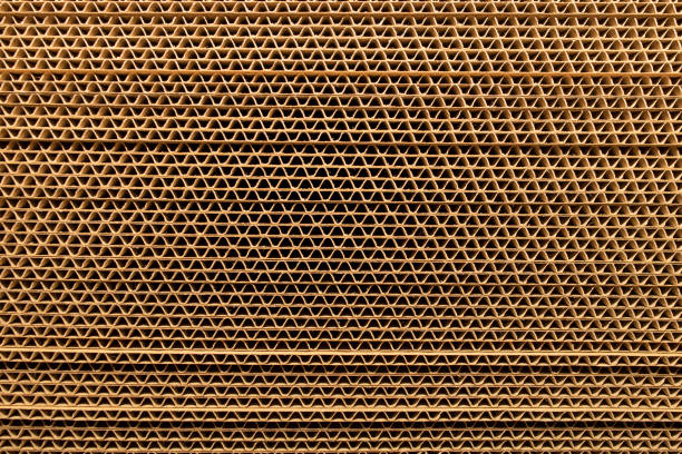 Stacked cardboard sheets, undulated paper Stacked cardboard sheets, undulated paper, stripped background fabric edge stock pictures, royalty-free photos & images