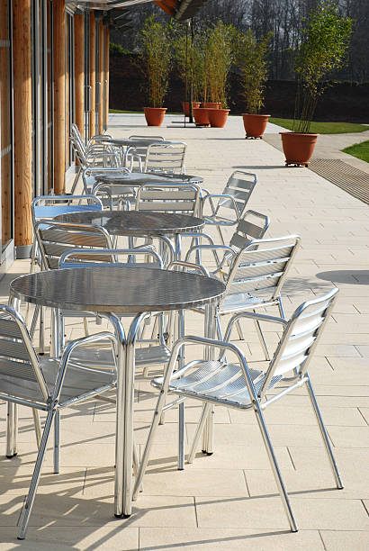 istock cafe terrace exterior with tables and chairs 147093341