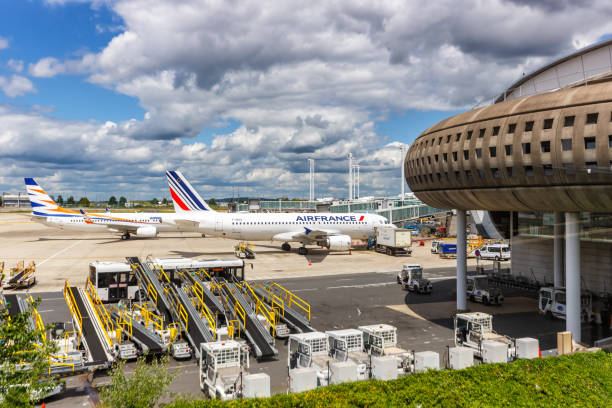 Airplanes at Paris Charles de Gaulle airport terminal 2 in France stock photo