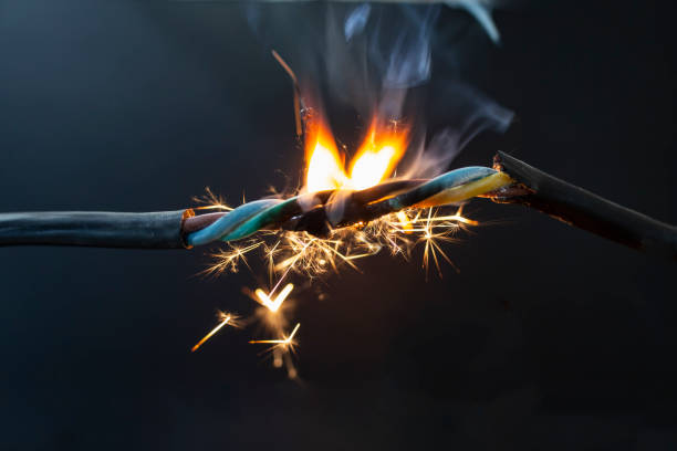 istock flame smoke and sparks on an electrical cable, fire hazard concept 1470934612