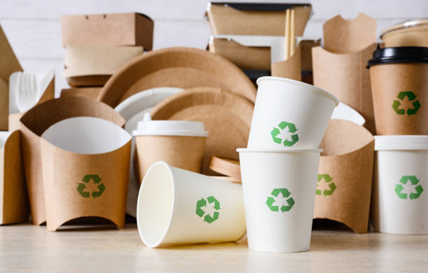istock Items made from biodegradable eco-friendly materials with green recycling signs in the kitchen. Zero waste and recycling concept. 1470938060