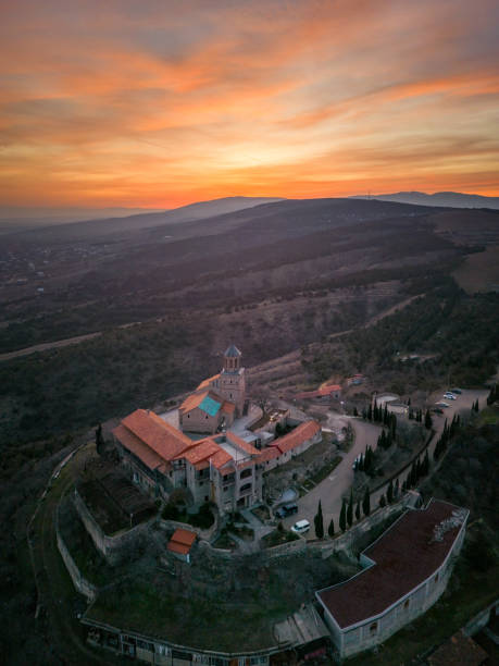 Vertical aerial shot of old monastery at sunset in Georgia stock photo