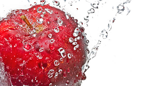 istock Red apple with drop of water isolated on white background 147093844