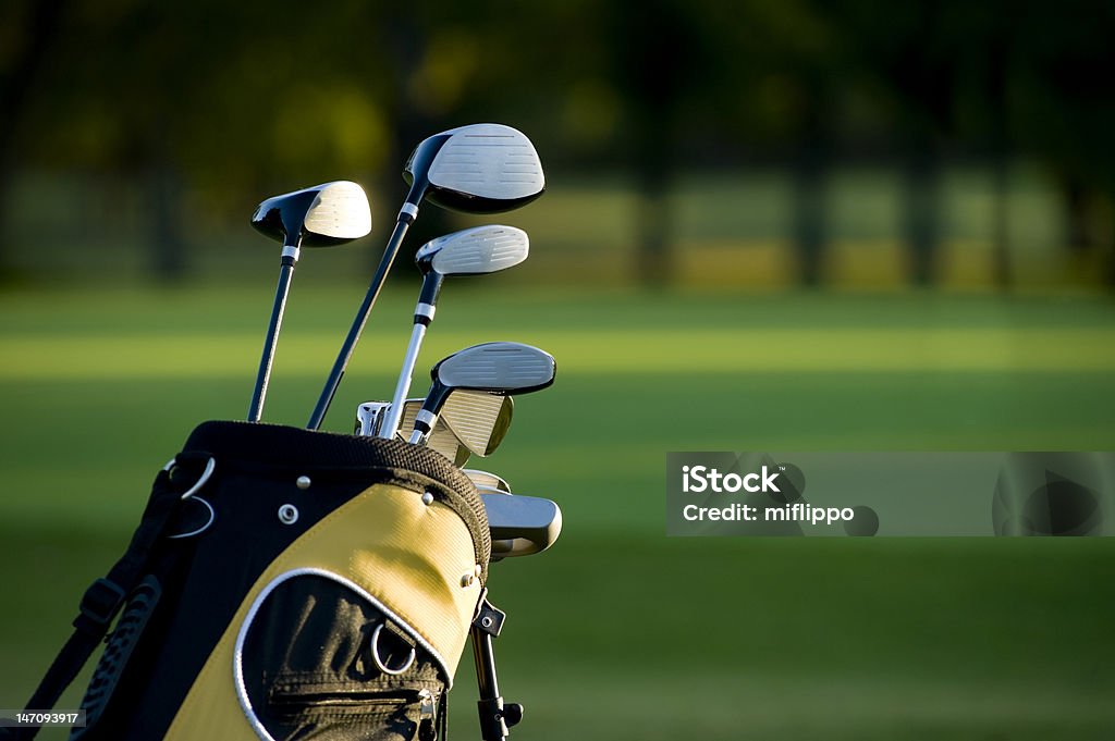 Golfing A set of new golf clubs on a beautiful golf course Golf Stock Photo
