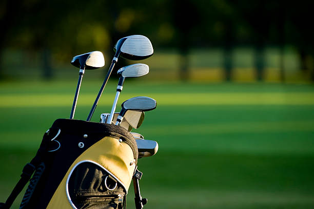 Golfing A set of new golf clubs on a beautiful golf course golf club stock pictures, royalty-free photos & images