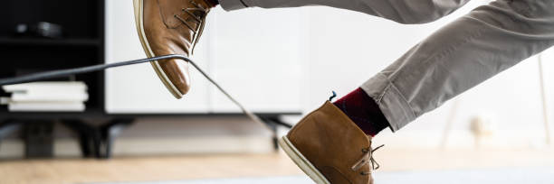 istock Wire Cord Trip Over And Fall. Feet Stumble 1470940248