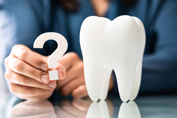 istock Woman Dental Teeth Question Mark 1470940459