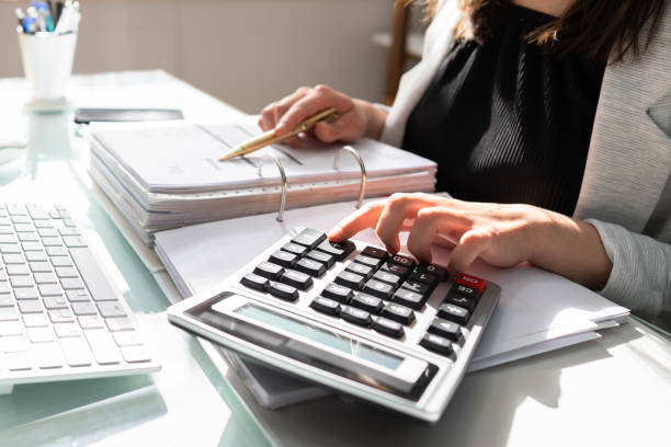 Professional Accountant Woman In Office Professional Accountant Woman In Office. Finance Invoice Accounting accountancy stock pictures, royalty-free photos & images