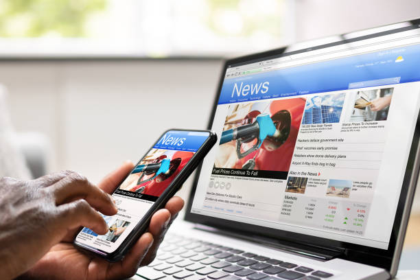 istock Watching Online News Article On Mobile Phone 1470940578