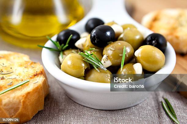 Olives With Garlic And Herbs Stock Photo - Download Image Now - Black Olive, Olive - Fruit, Bread