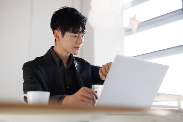istock Young businessman watching watch time 1470942004
