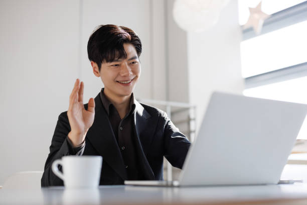 istock Businessmen use laptops to hold video conferences 1470942099