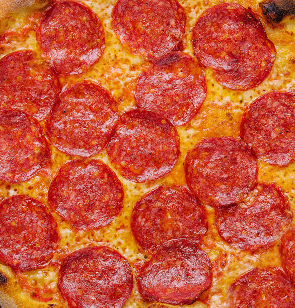 istock Fresh tasty pizza with pepperoni closeup 1470942111