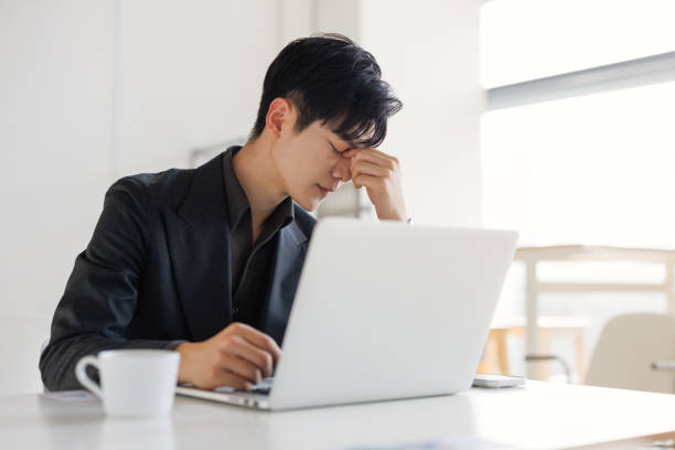 istock Young business men tired of work 1470942353
