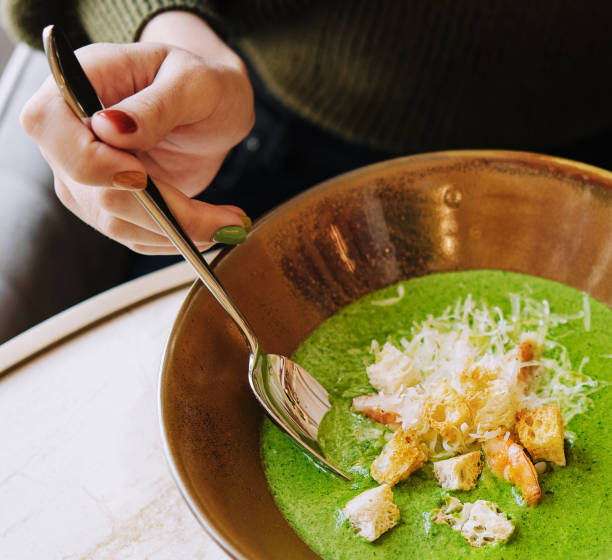 Broccoli green cream soup with shrimps